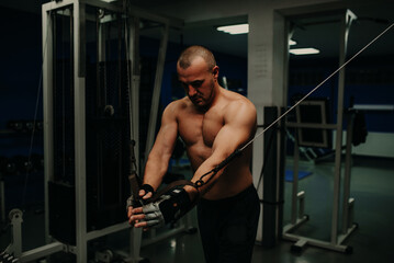 Obraz na płótnie Canvas Senior man at gym working exercise.