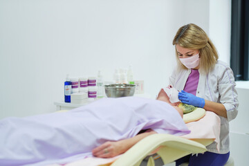Woman beautician doctor at work in spa center. Portrait of a young female professional cosmetologist. Healthcare occupation, medical career. soft focus