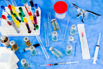 Corona virus and Covid - 19 new vaccine in ampules, needle and bottle