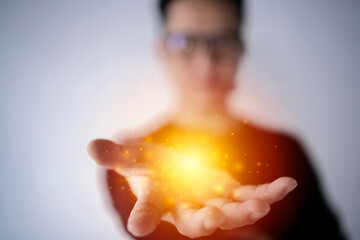 magic particles on the palms of a men, a stream of magical energy emanating from men hands