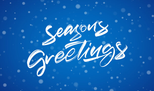 Handwritten modern brush typy lettering of Season's Greetings on blue winter background.