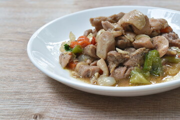 fried chicken with slice sweet bell chili black pepper sauce on palte