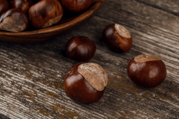 Chestnuts on an old wooden table