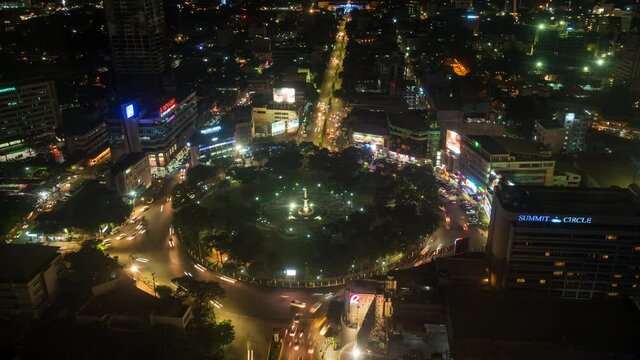 Time lapse view of night traffic around Fuente Osmena Circle in the heart of uptown Cebu City, Central Visayas, Philippines. 