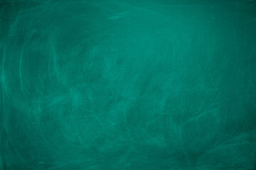 Abstract texture of chalk rubbed out on green blackboard or chalkboard background. School...