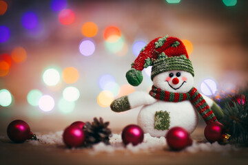 Christmas card. toy snowman on Christmas background.