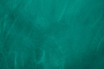 Abstract texture of chalk rubbed out on green blackboard or chalkboard background. School education, dark wall backdrop or learning concept.