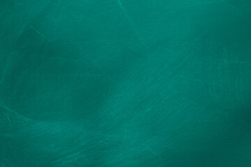 Abstract texture of chalk rubbed out on green blackboard or chalkboard background. School education, dark wall backdrop or learning concept.