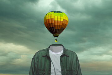 Sky. Male body of model with black air ballon instead head isolated on blue grey background. Trendy colours and modern design. Contemporary art collage. Inspiration, mood, creativity, brain concept