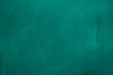 Abstract texture of chalk rubbed out on green blackboard or chalkboard background. School education, dark wall backdrop or learning concept.