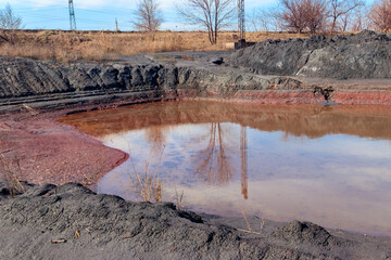Technical settler of industrial water of mining industry in Kryvyi Rih, Ukraine. Red water polluted...