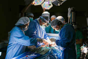 Surgeons in the operating room with a patient