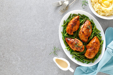 Roasted chicken breast with green beans, boiled mashed potatoes and gravy