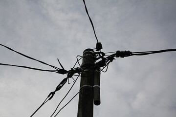 visible near the end of the cable pole with a cloudy sky