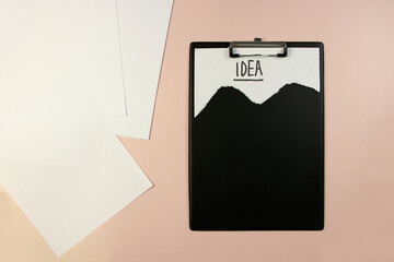 Stolen idea. clipboard top view on table on on colored background word idea marker conceptual photo top view.