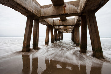 Wide angle view underneath an old pier on the Bay View Beach in Mosselbay South Africa