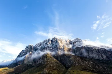 Foto op Canvas Wide Angle view of the Snow Capped mountains in the Du Toits Kloof pass in the Western Cape of South Africa © Dewald