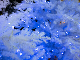 blue light bulbs on the Christmas tree. New Year