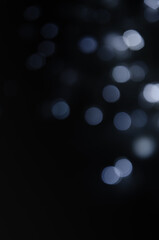 Abstract pattern of bokeh garland lights on a dark background