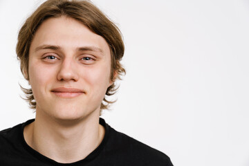 Happy young man wearing casual clothes standing