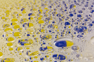 Water drops texture background. Water drops. Yellow and blue.Selective focus.