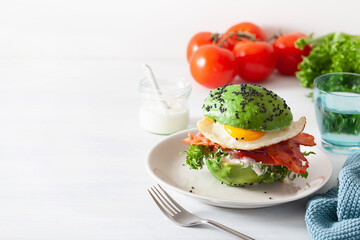 keto paleo diet avocado breakfast burger with bacon, egg, tomato