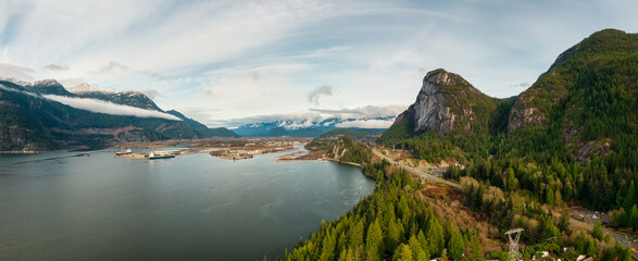 Fototapeta na wymiar Aerial panoramic view of Sea to Sky Highway with Chief Mountain in the background. Sunny Fall Season. Taken near Squamish, North of Vancouver, British Columbia, Canada.