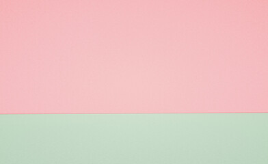 Abstract horizontally divided bi-color retro background, paper texture. Pastel pink and green color.