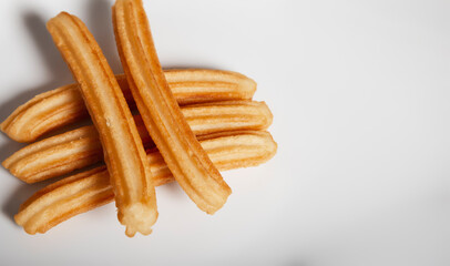 Various churros on white background with copy space for text