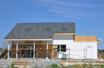 The house facade and patio renovation. Painting, rendering and renovating the exterior walls of a...