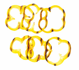 grilled yellow bell pepper slices isolated on white background. Top view.