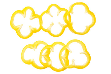 Yellow  sweet bell pepper slices isolated on white background. Top view.