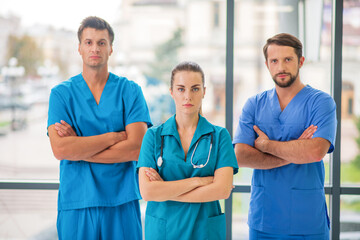 Group of doctors standing and looking determined