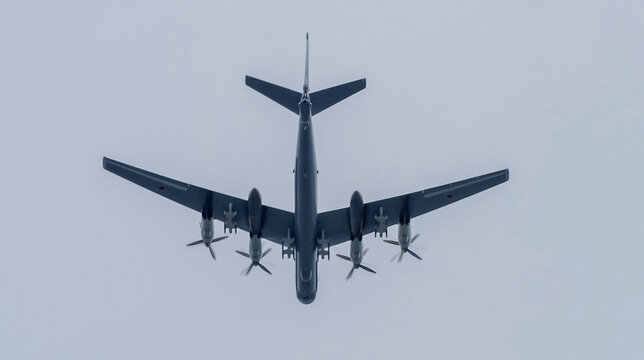 May 9, 2020 Moscow, Russia Silhouette of the Russian turboprop strategic bomber Tupolev Tu-95 in the overcast sky.
