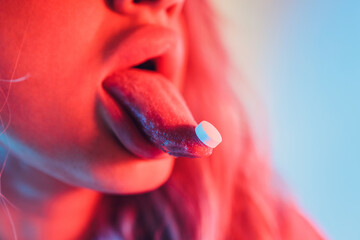 beautiful girl with lsd on tongue in nightclub with pink smoke.
