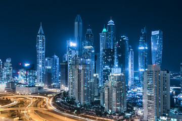 Cityscape and skyline at night in Dubai Marina.	
