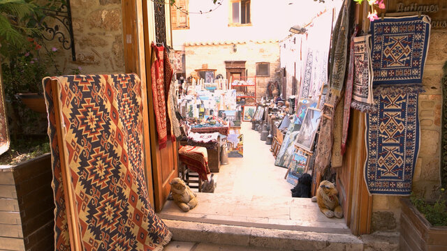 Carpet shop at the street market. Turkish handmade souvenirs for sale at outdoor market. Kaleici, Antalya, Turkey.