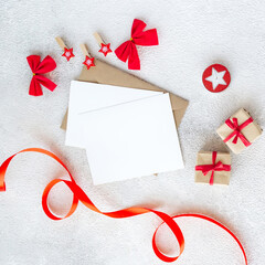 Christmas and New Year decorations with empty card and envelope on white background. Flat lay composition with copy space. - 396823425