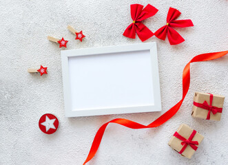 White blank frame and Christmas decor on gray background. - 396823458