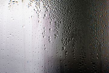 Misted window, beautiful drops of water on the glass