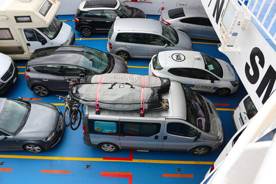 Cars and camper vans on a ferryboat to Sicily in the Strait of Messina, Italy