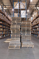 Pallets And Boxes Stacked In Warehouse
