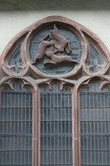 Famous window with three rabbits in the inner courtyard of the cathedral in Paderborn, NRW, Germany
