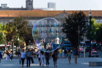 Big soap bubble and Porto city in the background. Aliados Avenue.