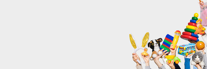 Toys in the hands on white background