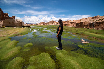 Woman in a scenic lake in the southwest of the Bolivian altiplano