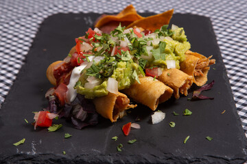 Flautas de pollo tacos and Salsa Homemade food Mexican mexico city.