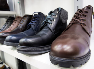 Voronezh, Russia - February 29, 2020: New leather men's boots are on the shop window