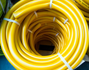 Voronezh, Russia - February 29, 2020: New watering hose coiled up top view