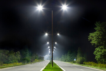 night empty road with bright LED streetlights, modern illumination